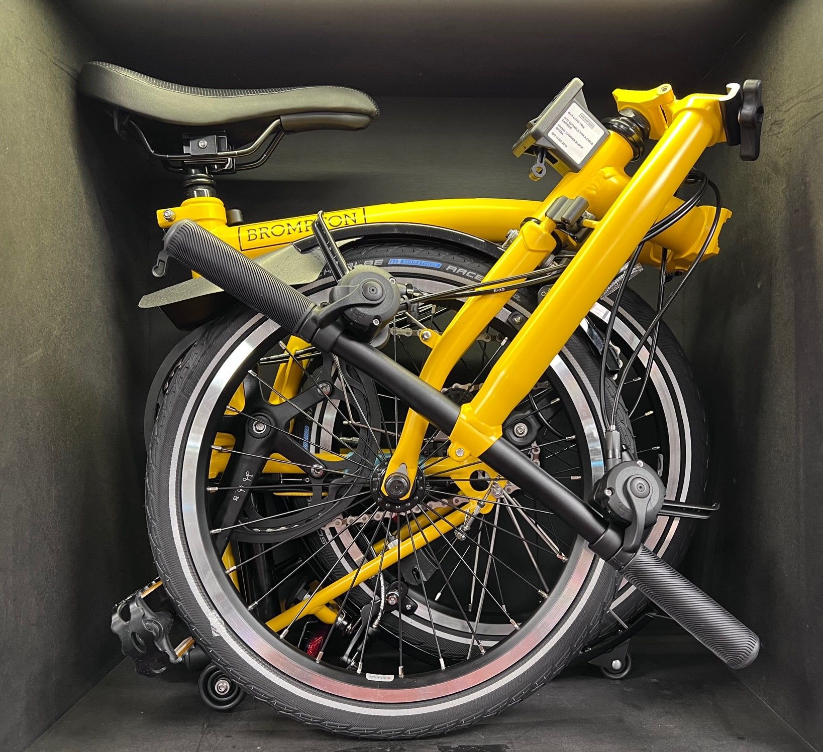 yellow brompton bike